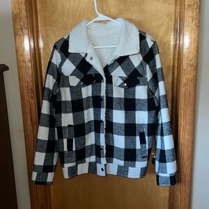 Boutique purchase. Black & white plaid Sherpa lined button up jacket w/pockets.